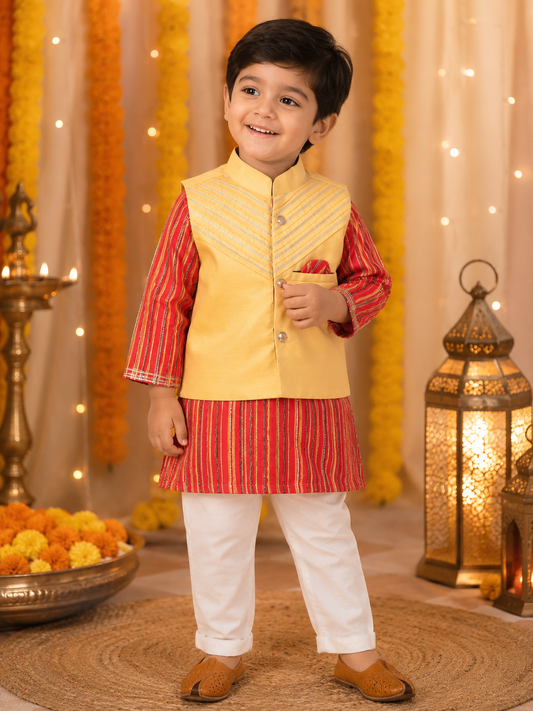 Child wearing a traditional outfit with a yellow vest and red shirt in a decorated setting.