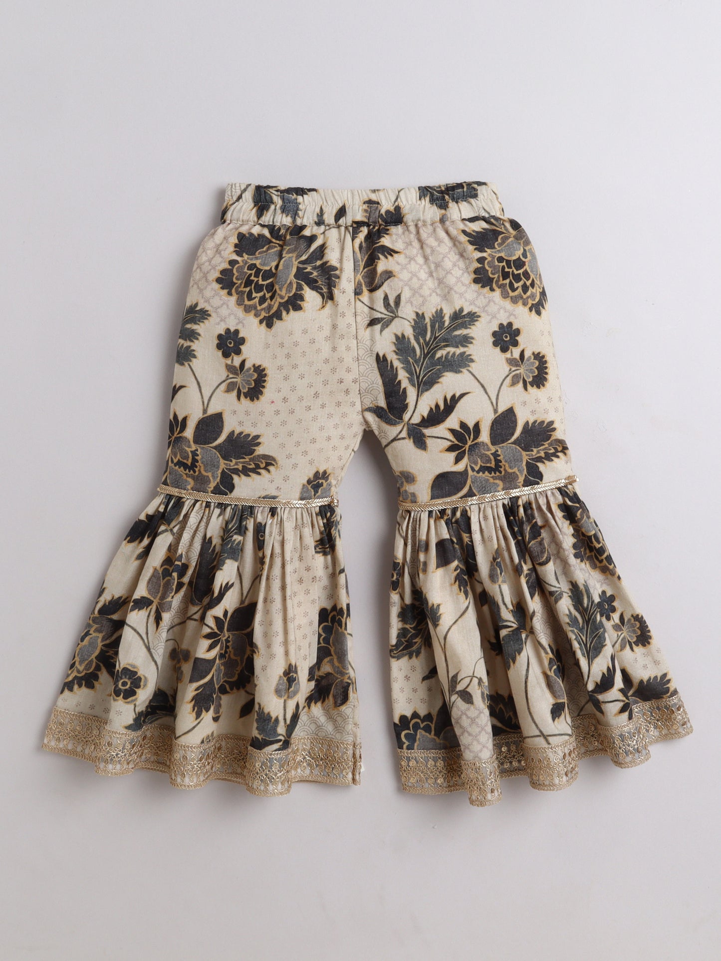 Elegant kids ethnic wear flared pants designed with floral prints and lace details