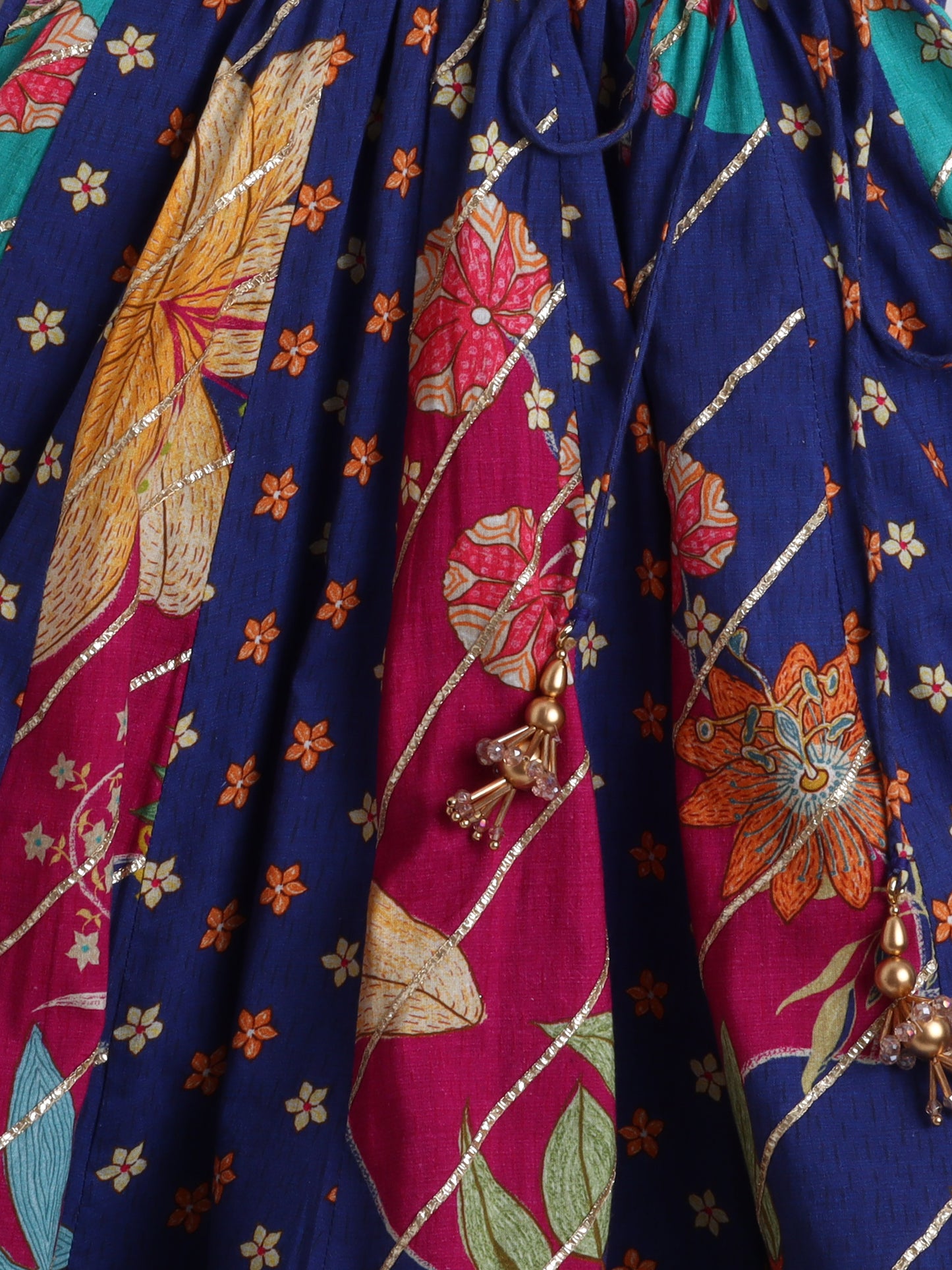 Indigo floral lehenga choli girls featuring vibrant floral prints and decorative tassels