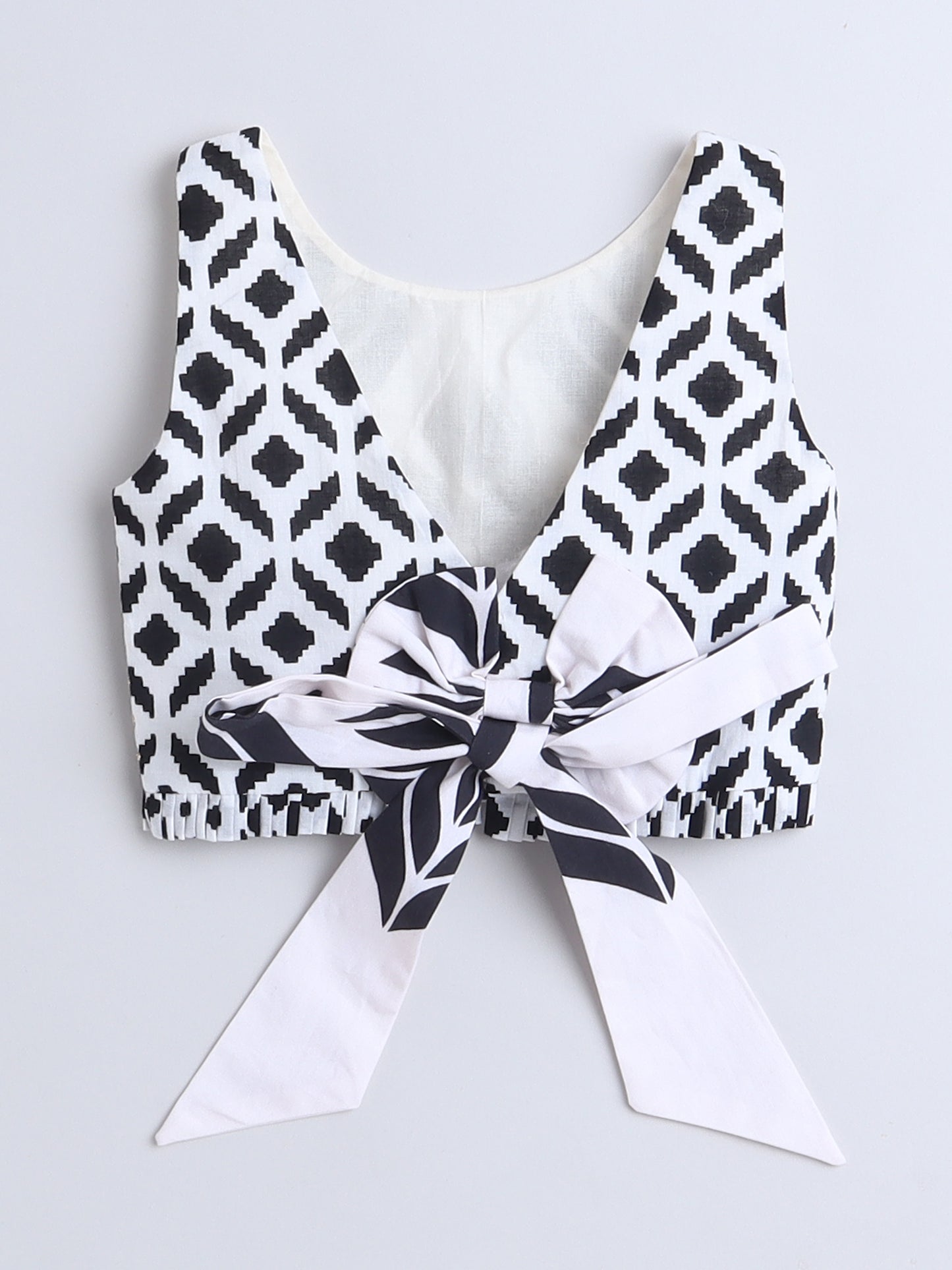 Stylish black and white Lehenga Choli top with a bow tie for festive occasions