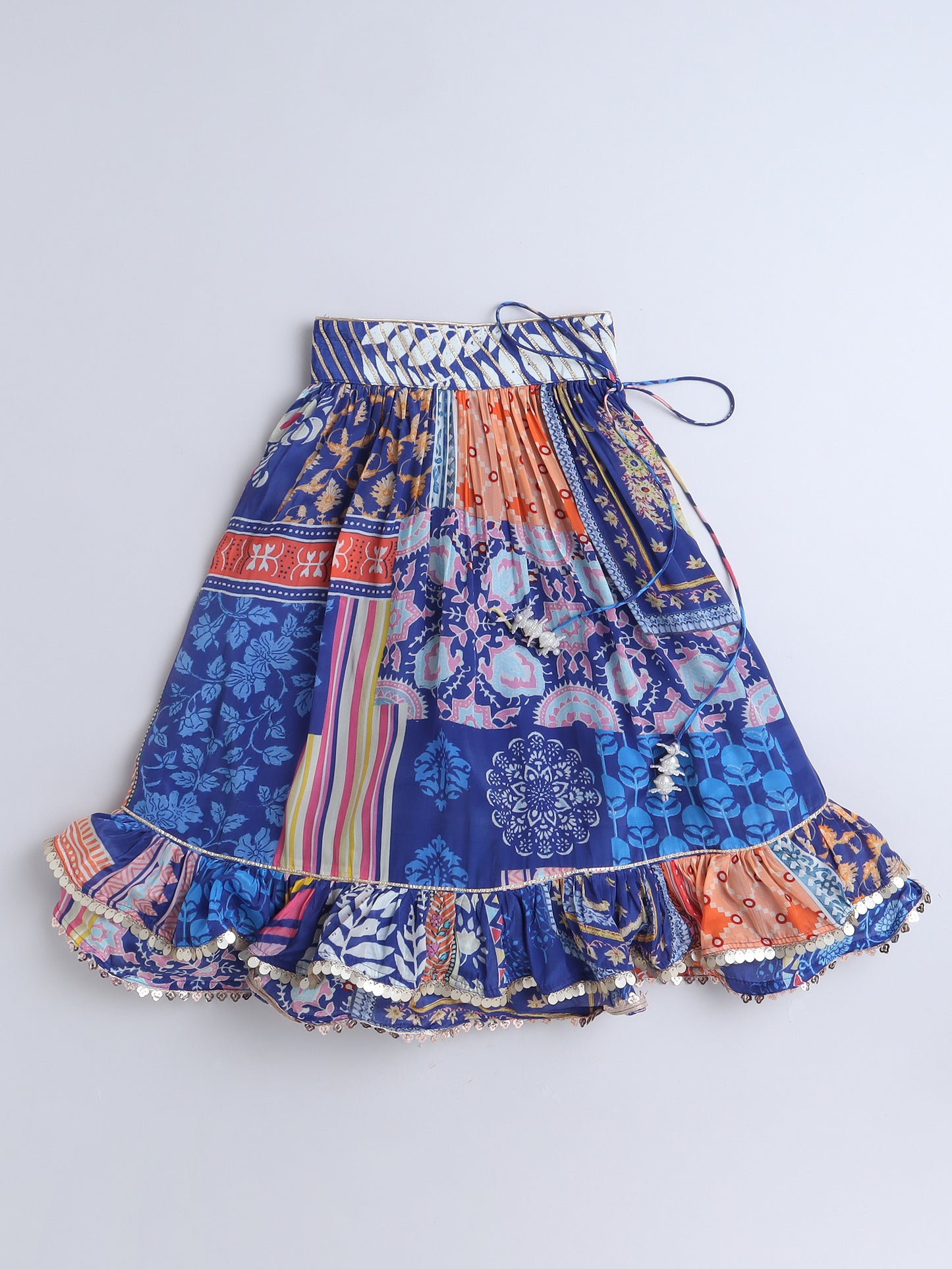 Multicolored patterned skirt on a blue background
