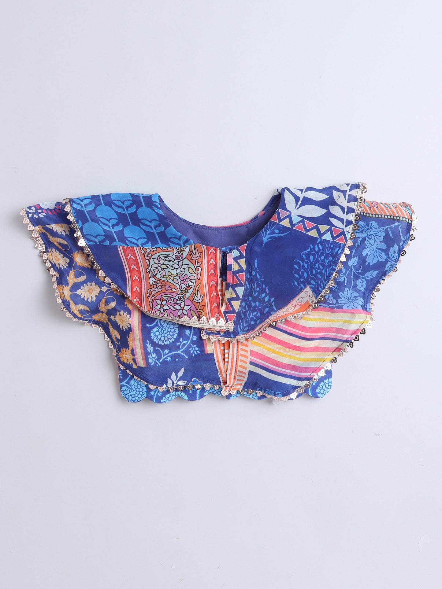 Colorful fabric blouse with patterns on a blue background