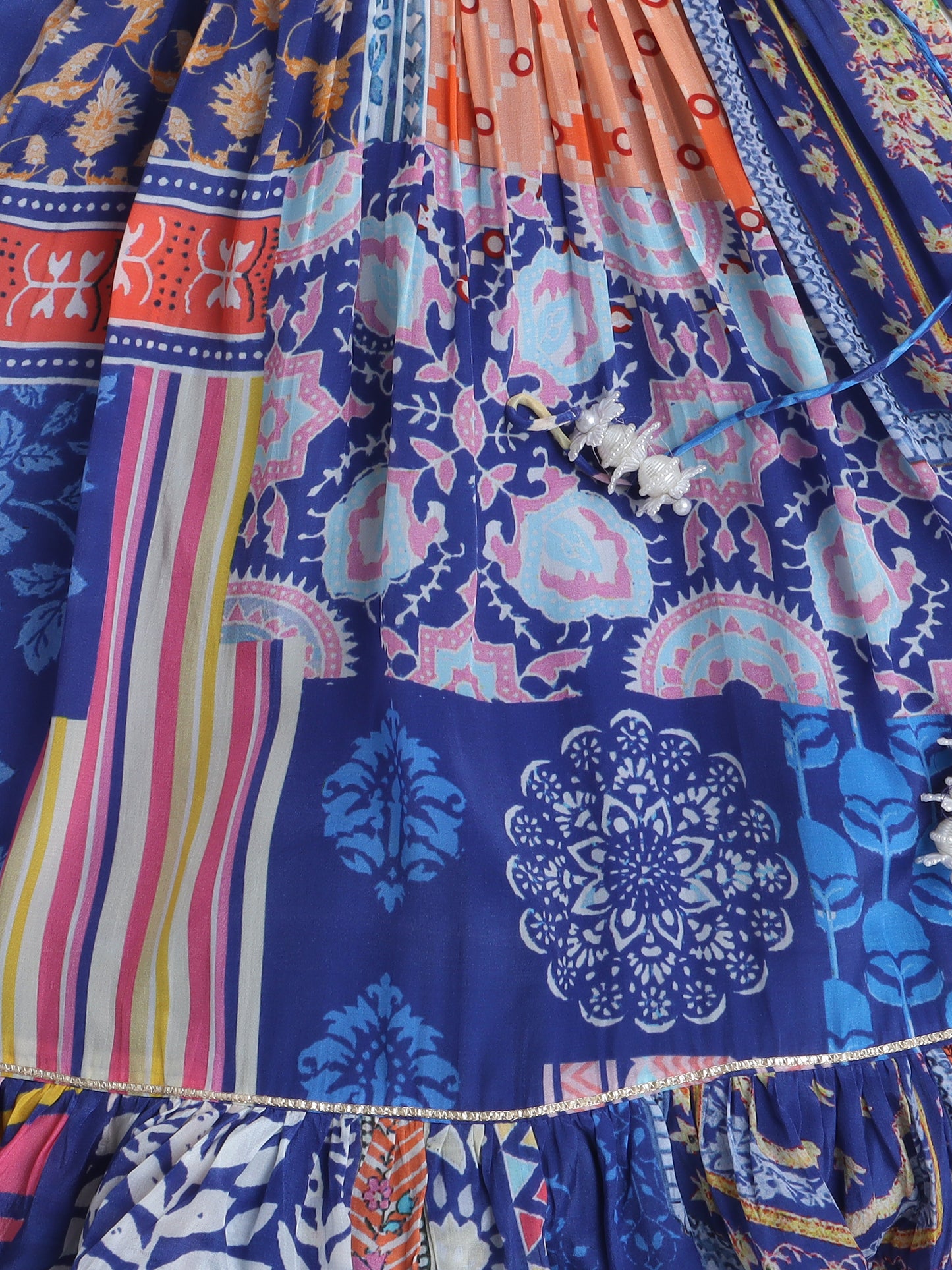 Close-up of a colorful patterned fabric with intricate designs.