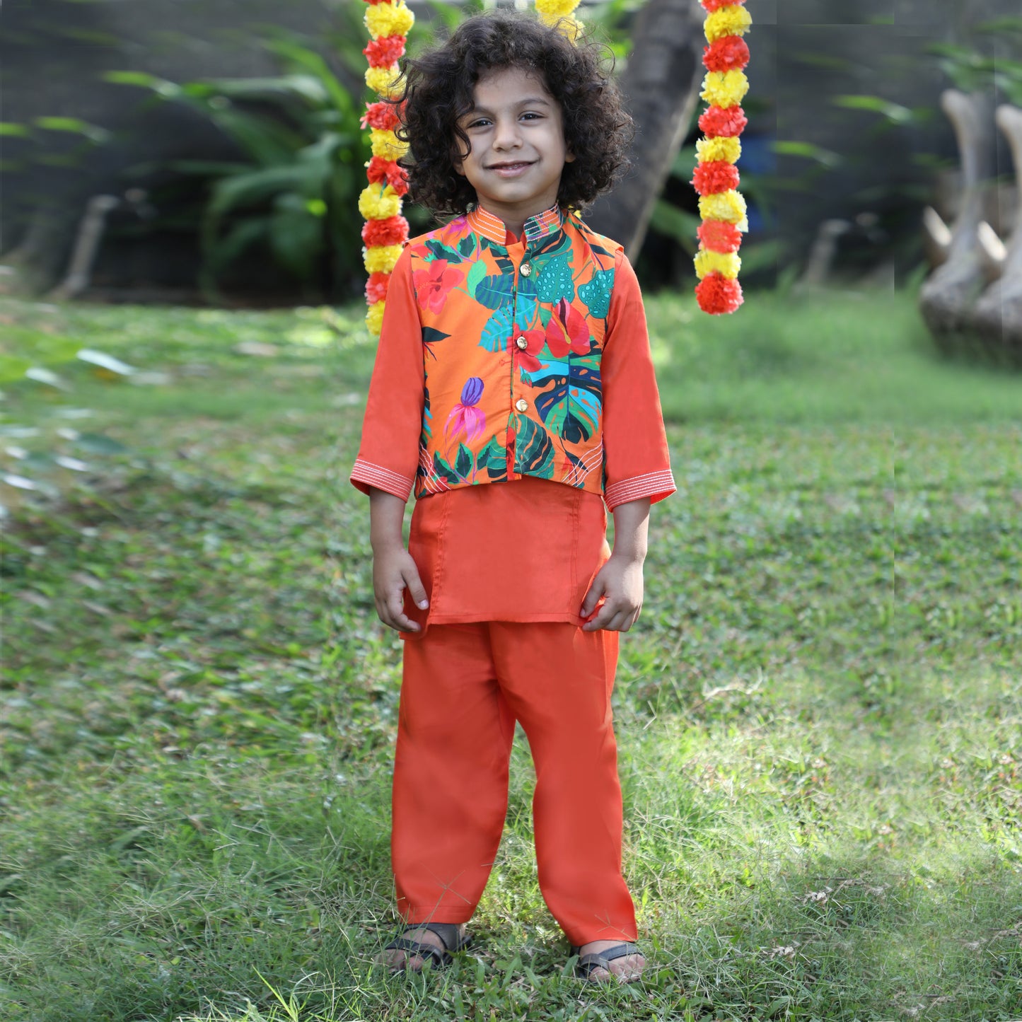 Boys Indian Pintex Orange Kurta With Hibiscus Printed Sleeveless Jacket And Pyjama - funlittleones.com