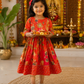 Girl Wearing Red Floral Dress For a Pooja 
