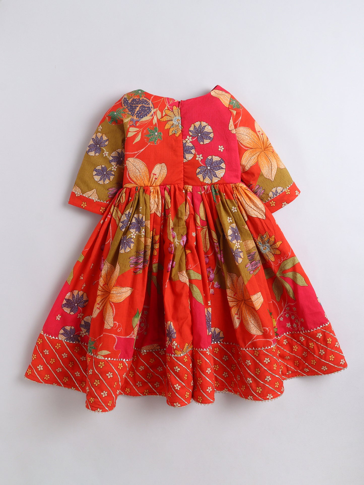 Red floral dress on a white background
