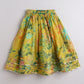 Yellow skirt with floral pattern on a gray background