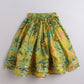 Yellow floral skirt on a light gray background