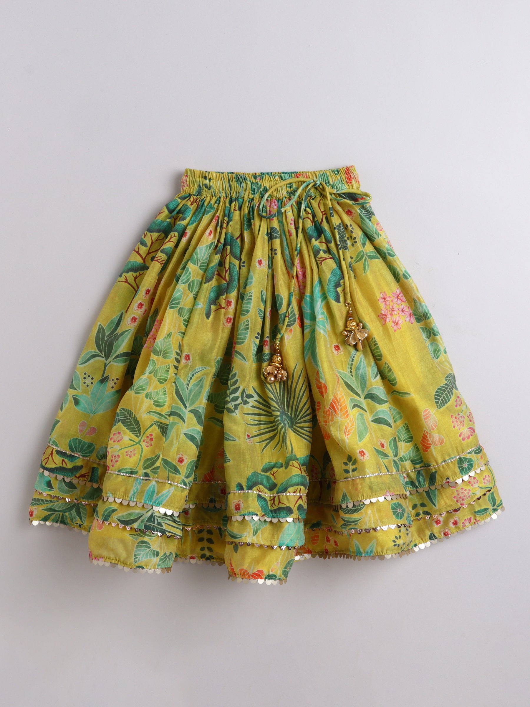 Yellow floral skirt on a light gray background
