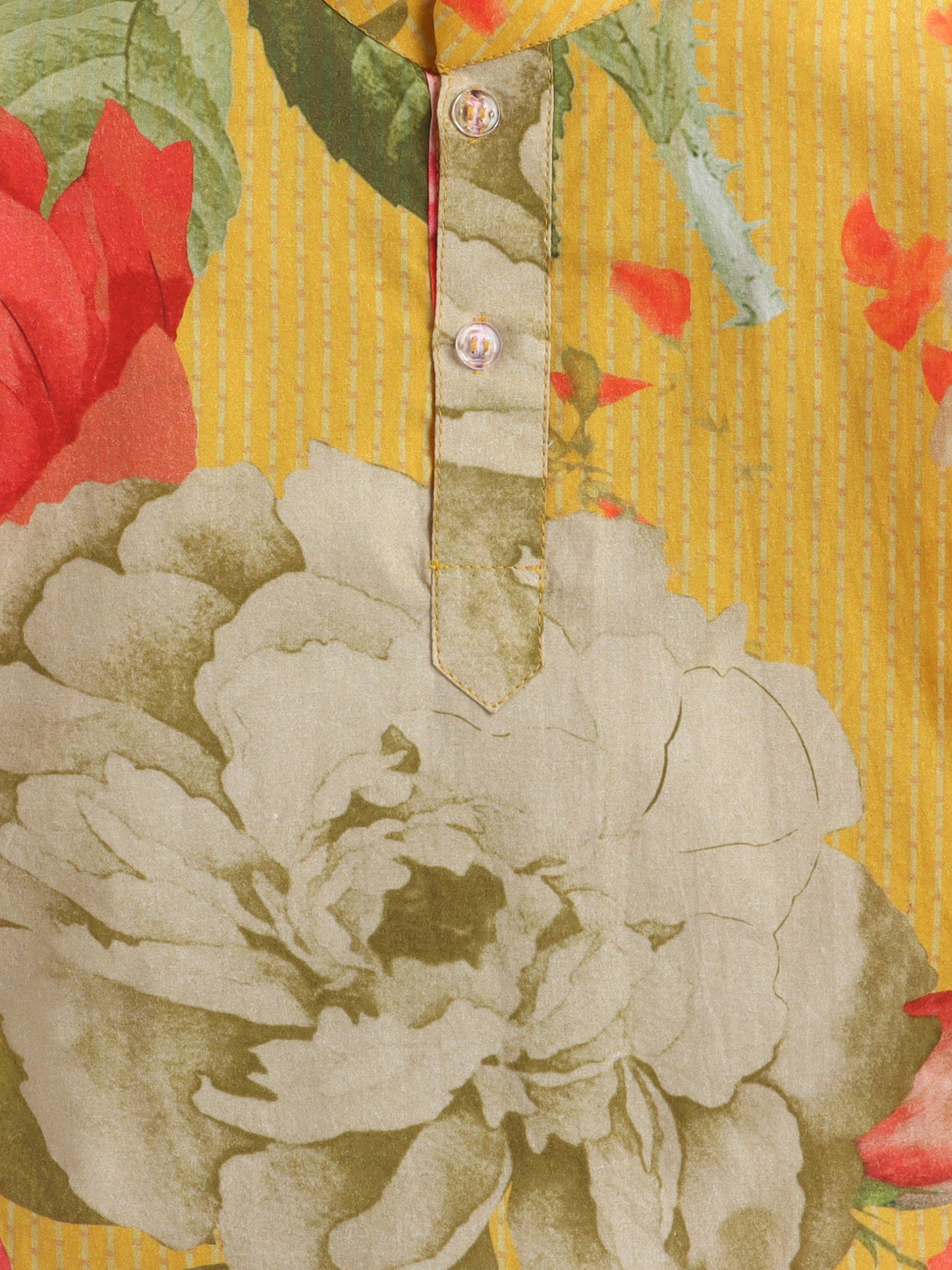 Close-up of a floral patterned fabric with red and green colors.