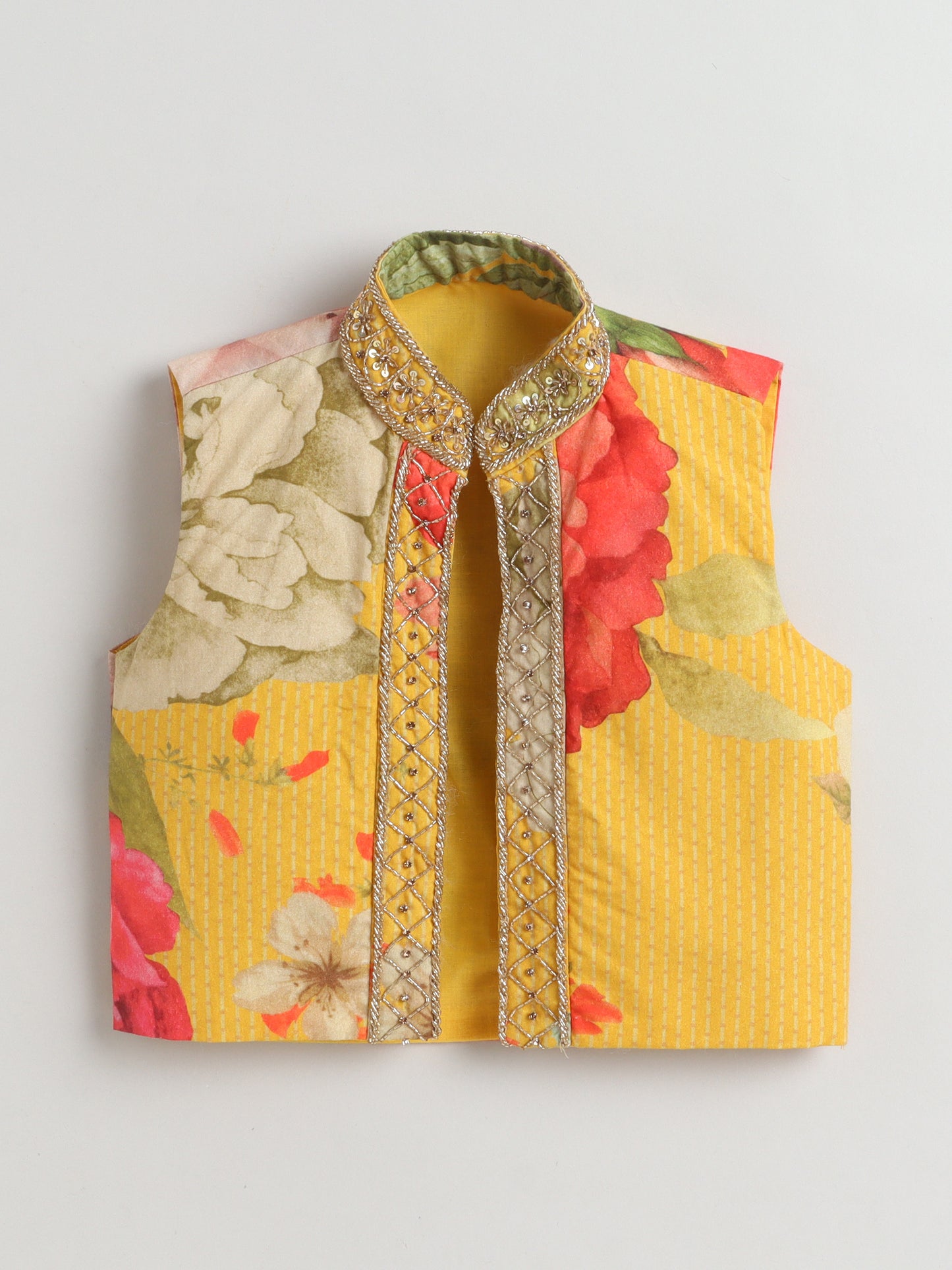 Floral patterned vest with embroidered details on a light gray background