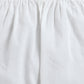 Close-up of a white skirt with an elastic waistband