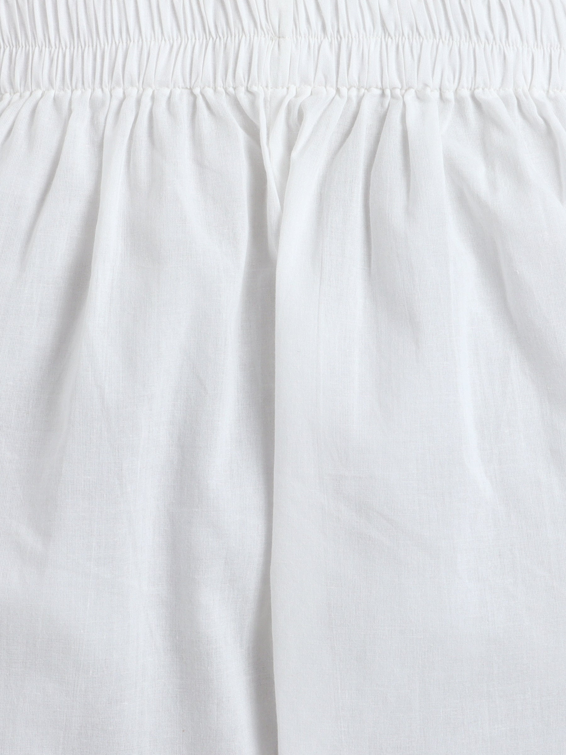 Close-up of a white skirt with an elastic waistband