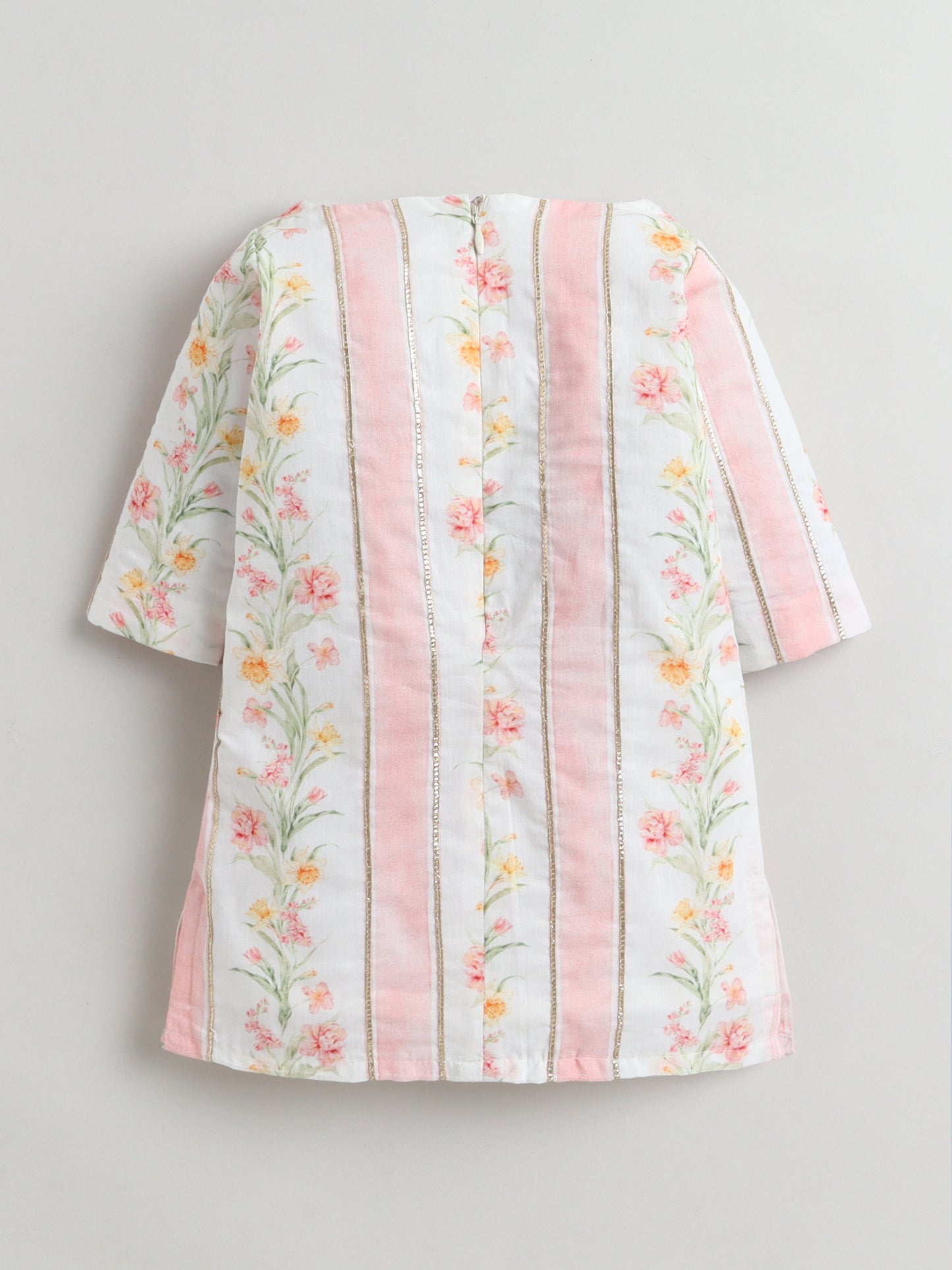 Floral-patterned dress with pink accents on a gray background