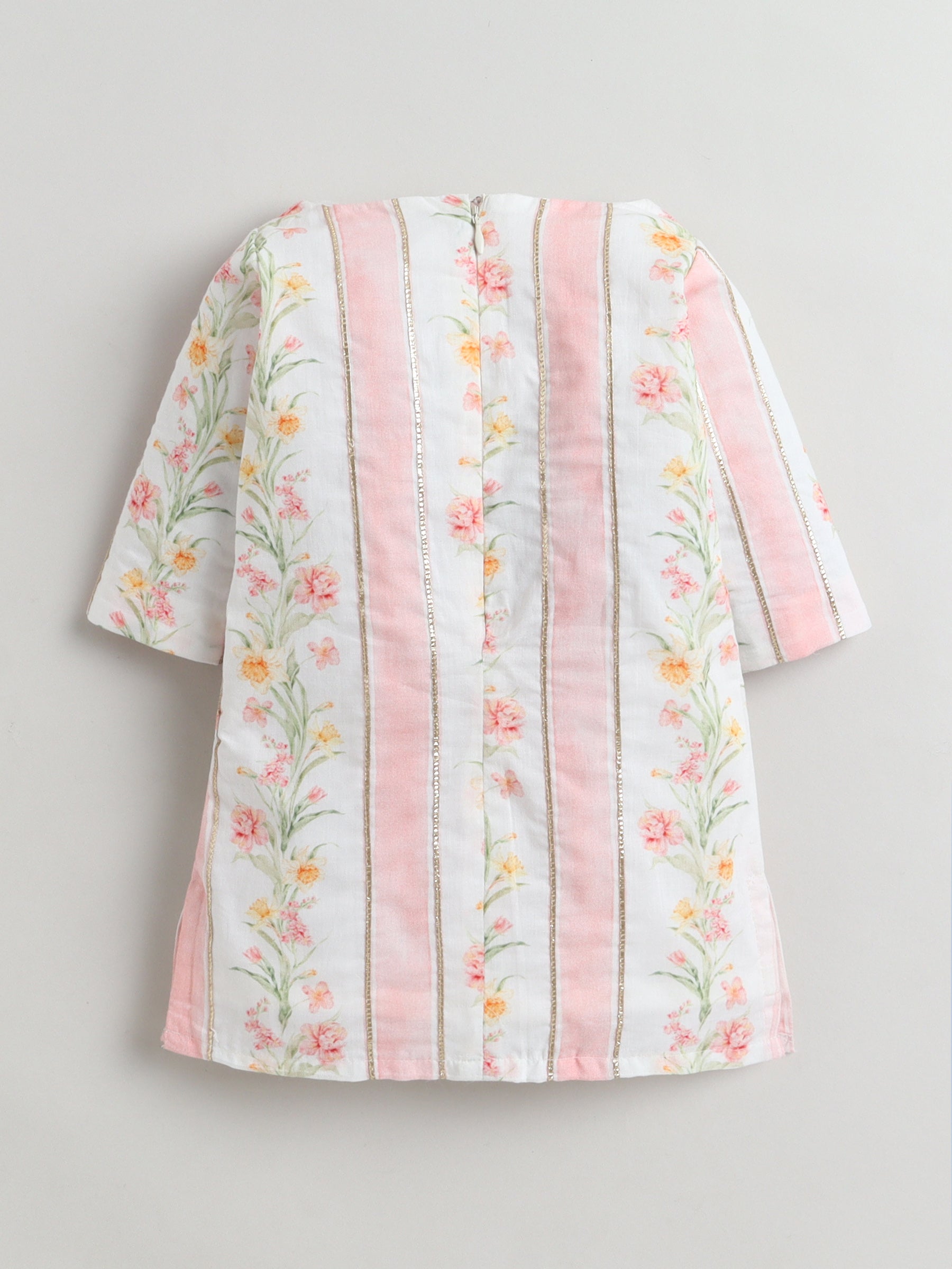 Floral-patterned dress with pink accents on a gray background