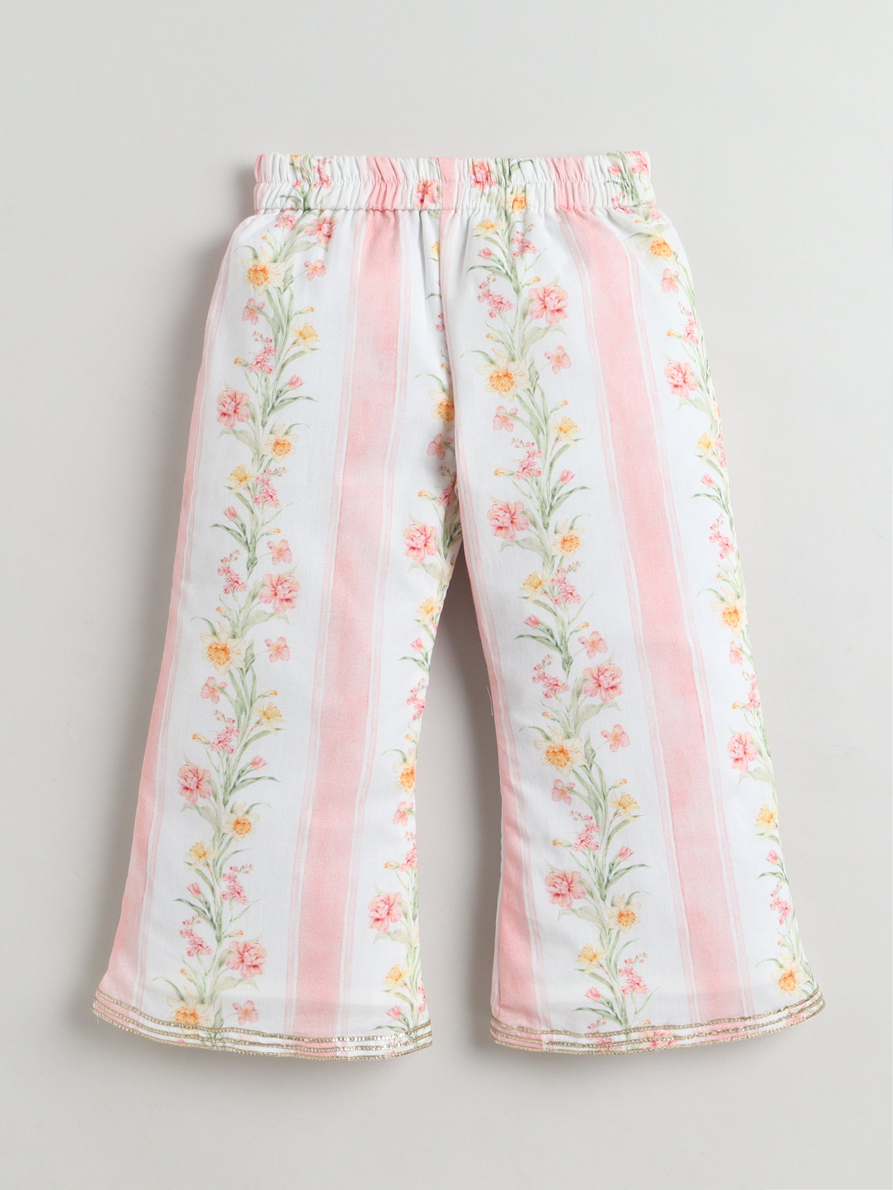 Floral-patterned pants with pink stripes on a light gray background