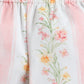 Floral-patterned pants with a soft pink border