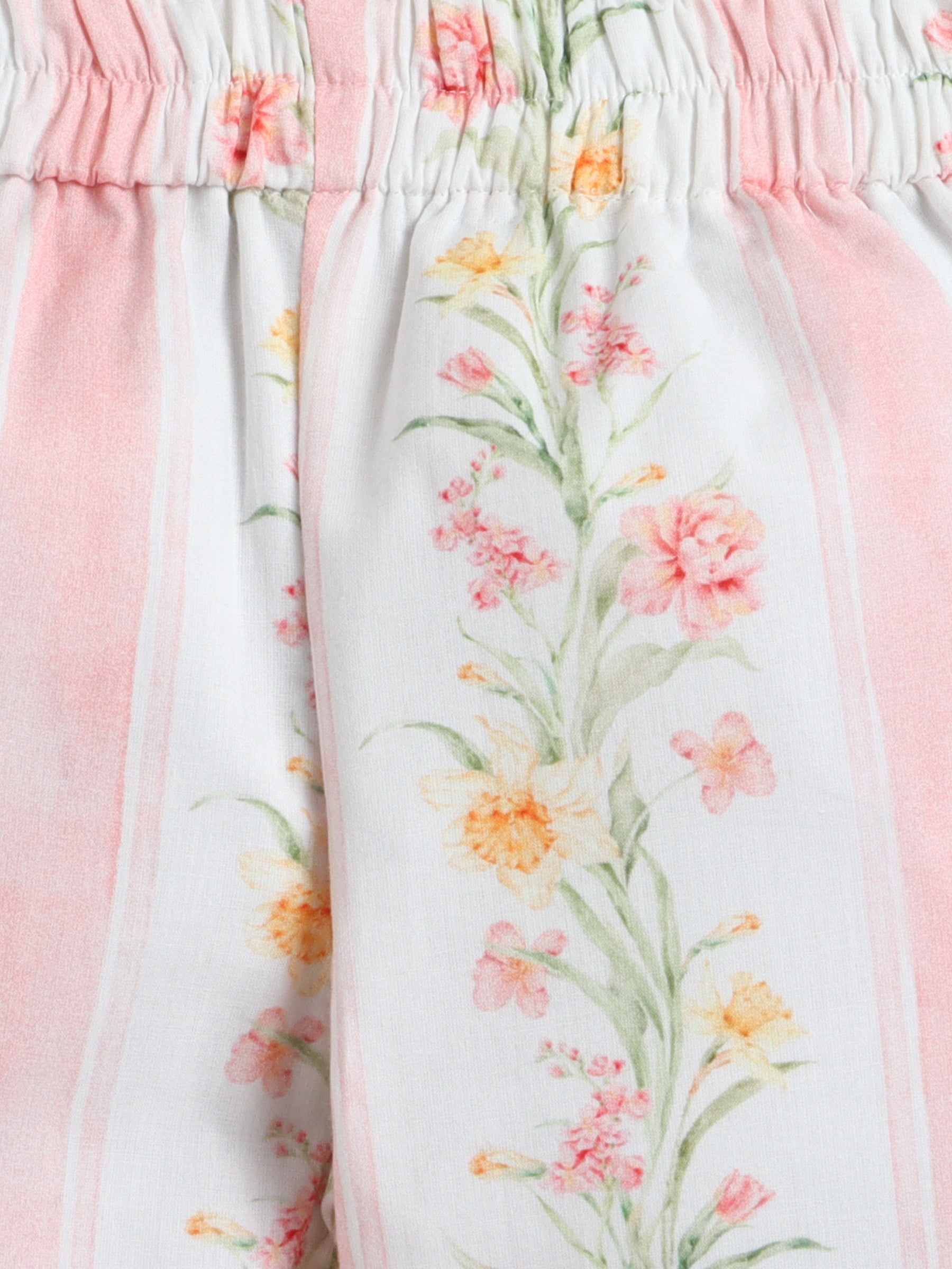 Floral-patterned pants with a soft pink border