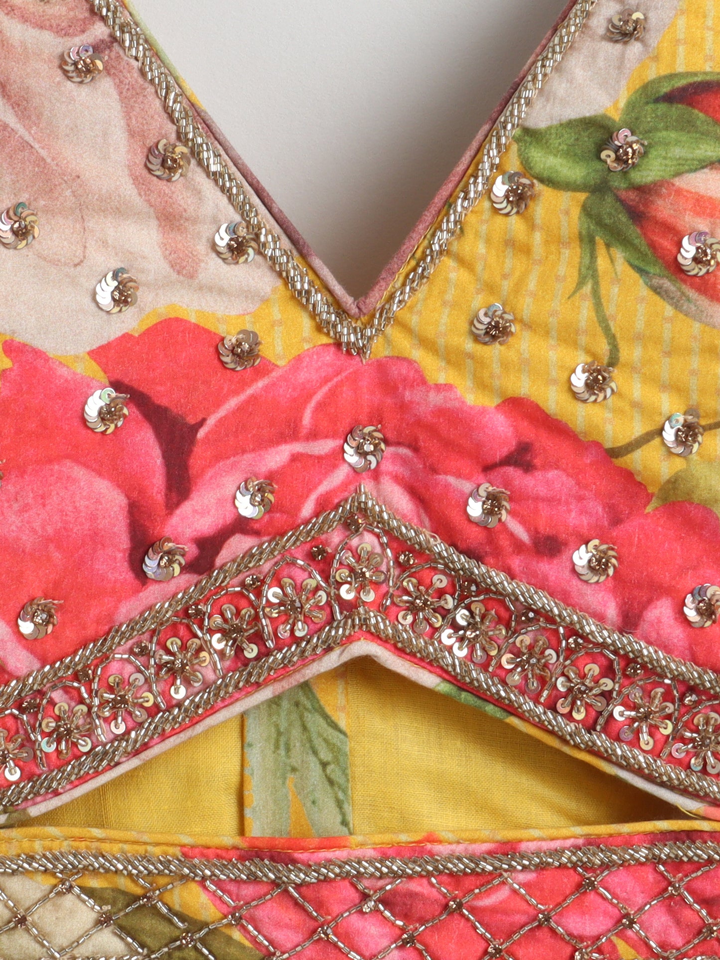 Decorative fabric with floral patterns and gold embroidery
