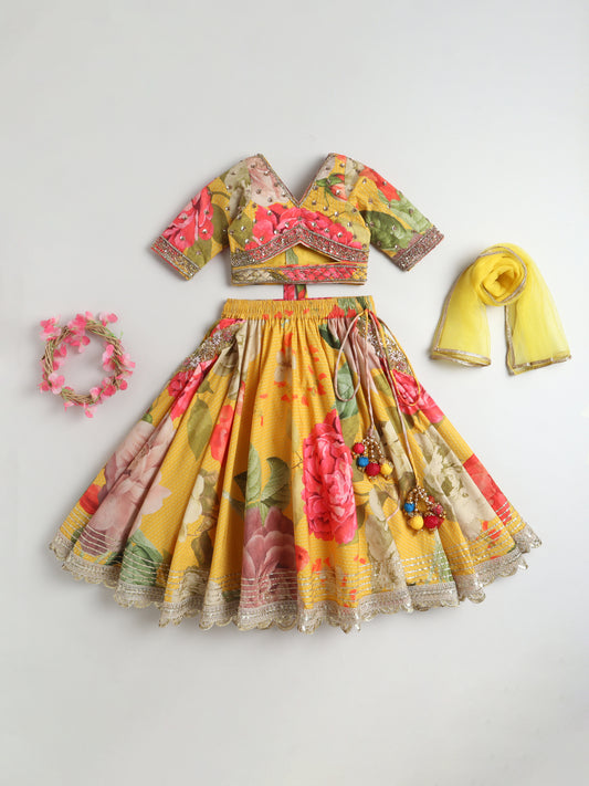 Colorful traditional outfit with floral patterns on a light gray background