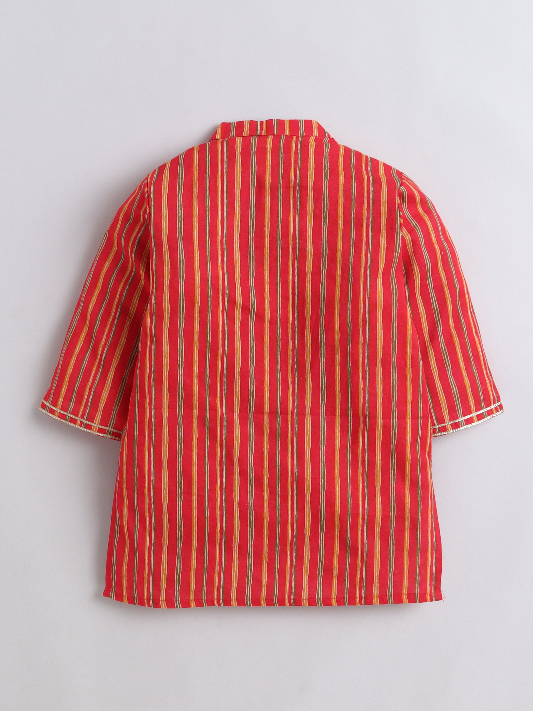 Red and yellow striped shirt on a light gray background