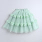 Light green tutu skirt on a light gray background