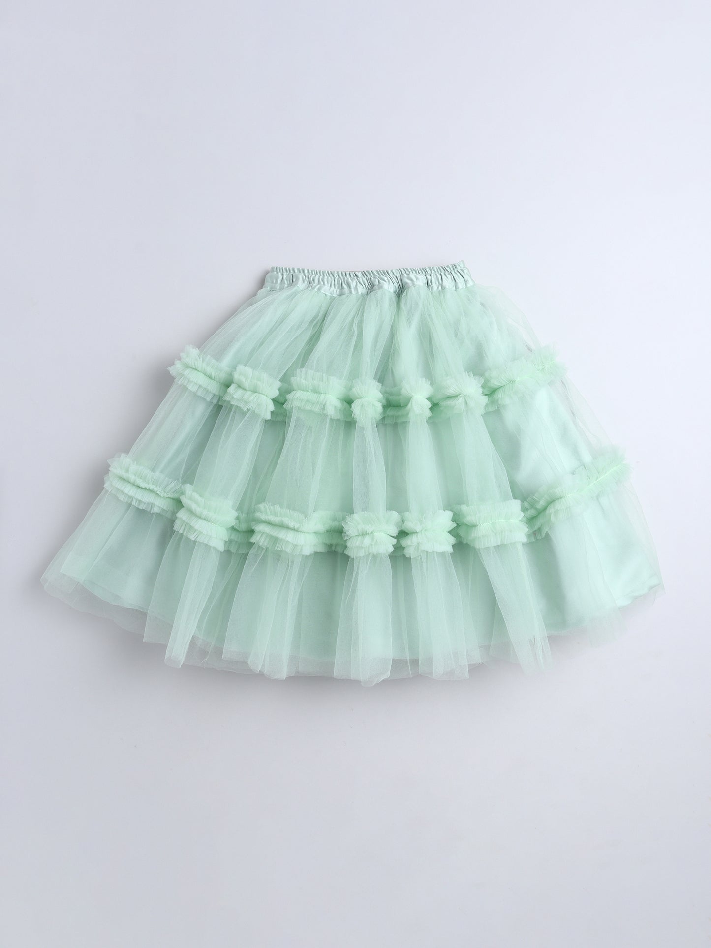 Light green tutu skirt on a light gray background