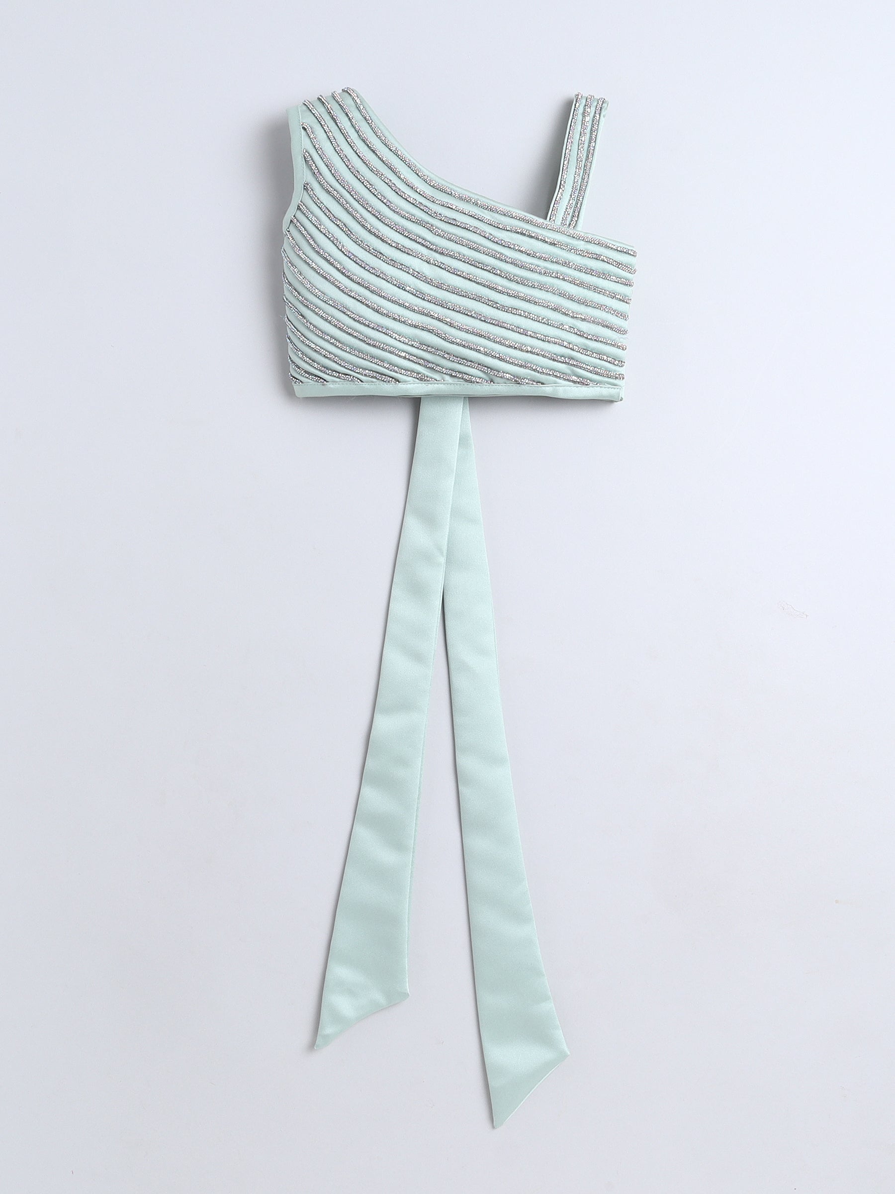 Mint green crop top with a bow on a light gray background