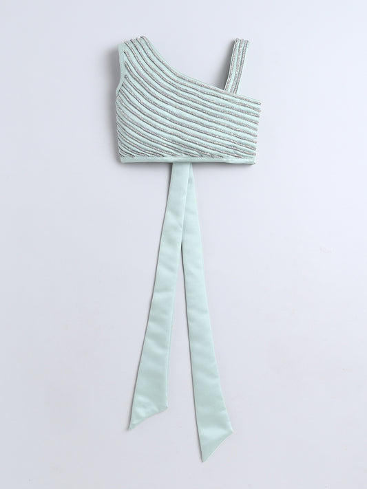 Mint green crop top with a bow on a light gray background