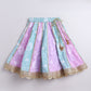 Pastel-colored skirt with floral patterns on a light gray background