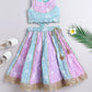 Pastel blue and lavender embroidered lehenga choli set for girls with floral thread work and pearl detailing – front view.