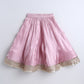 Pink skirt with gold trim on a white background