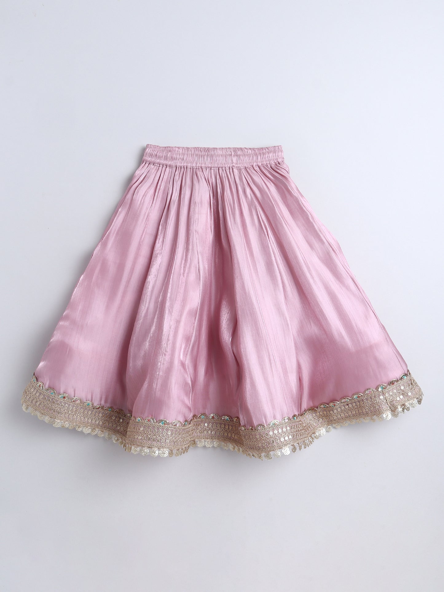 Pink skirt with gold trim on a white background