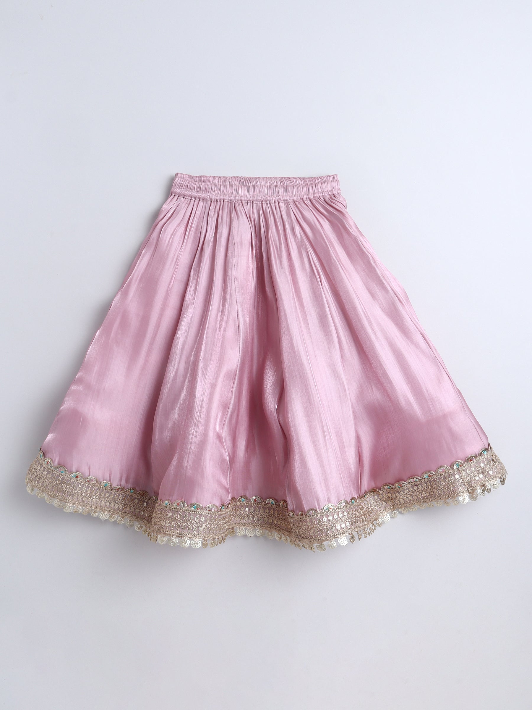 Pink skirt with gold trim on a white background