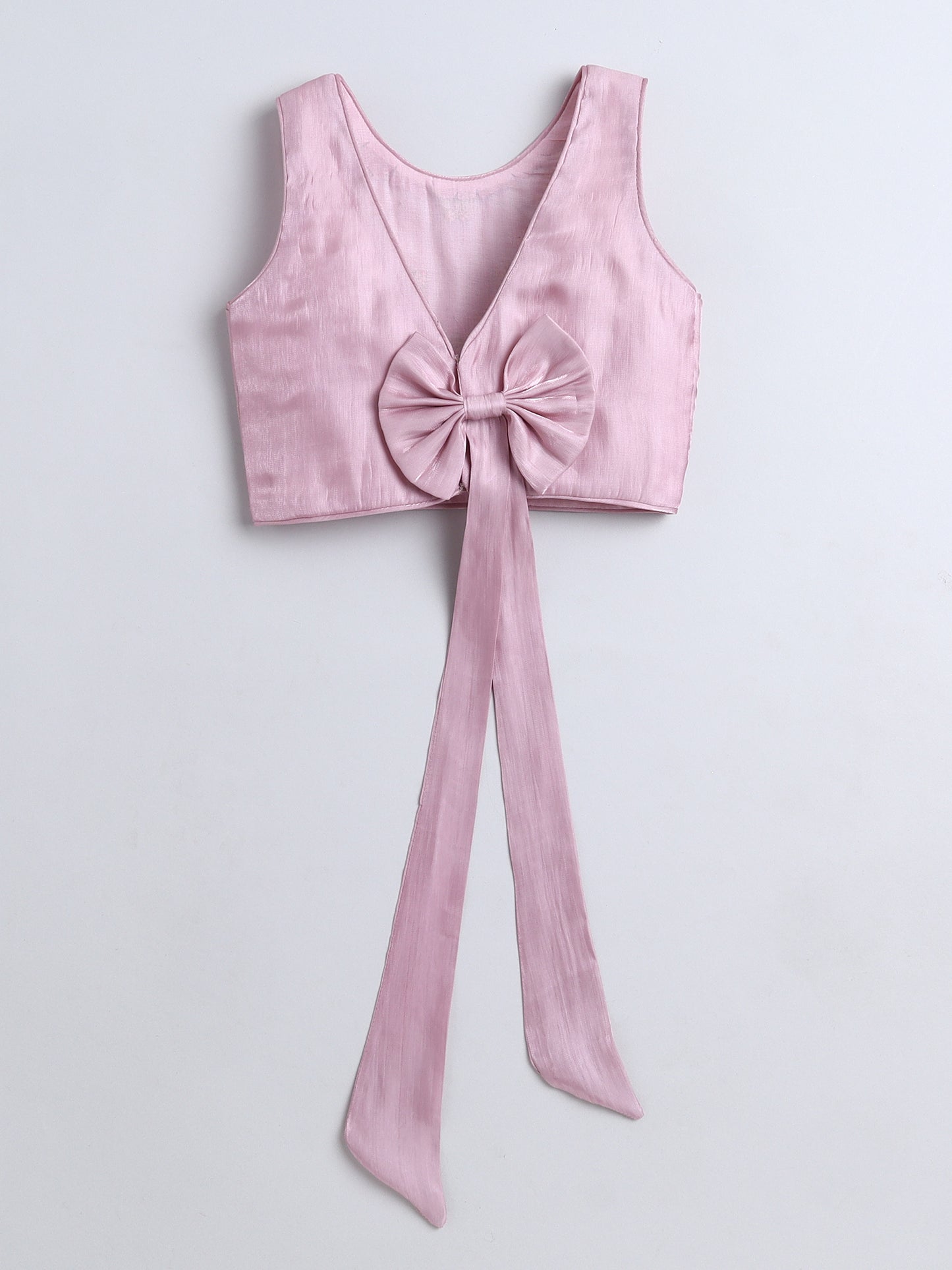 Pink crop top with a large bow on a light gray background