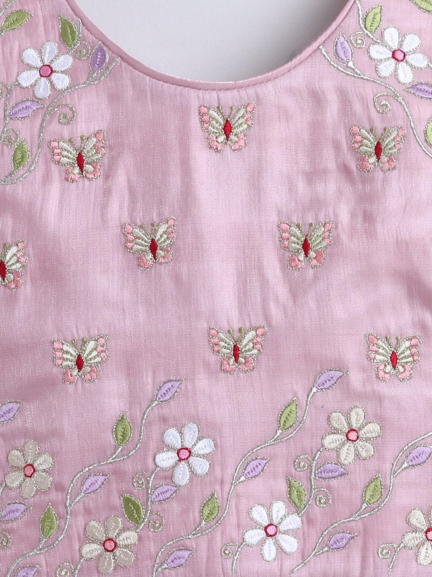 Pink fabric with floral and butterfly embroidery