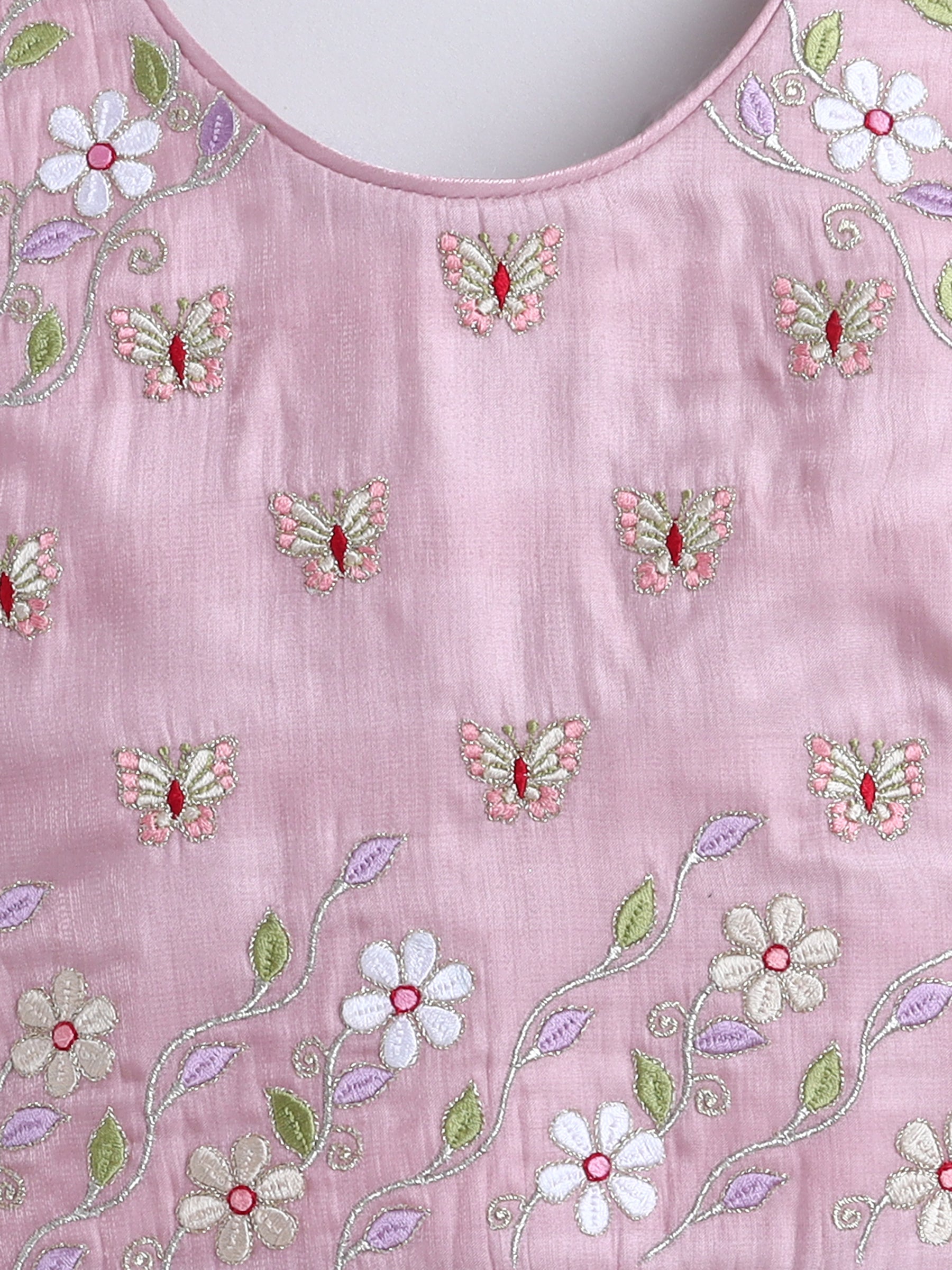 Pink fabric with floral and butterfly embroidery