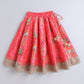 Red skirt with floral patterns and gold trim on a light gray background