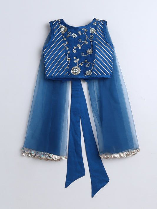 Blue embroidered dress with a white background