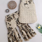 Elegant kids ethnic wear featuring a floral top and flared pants in neutral tones