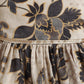 Close-up of elegant kids ethnic wear with floral patterns and intricate detailing