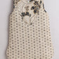 Elegant kids ethnic wear featuring a sleeveless design with floral embroidery and polka dots