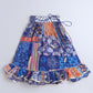 Multicolored patterned skirt on a blue background