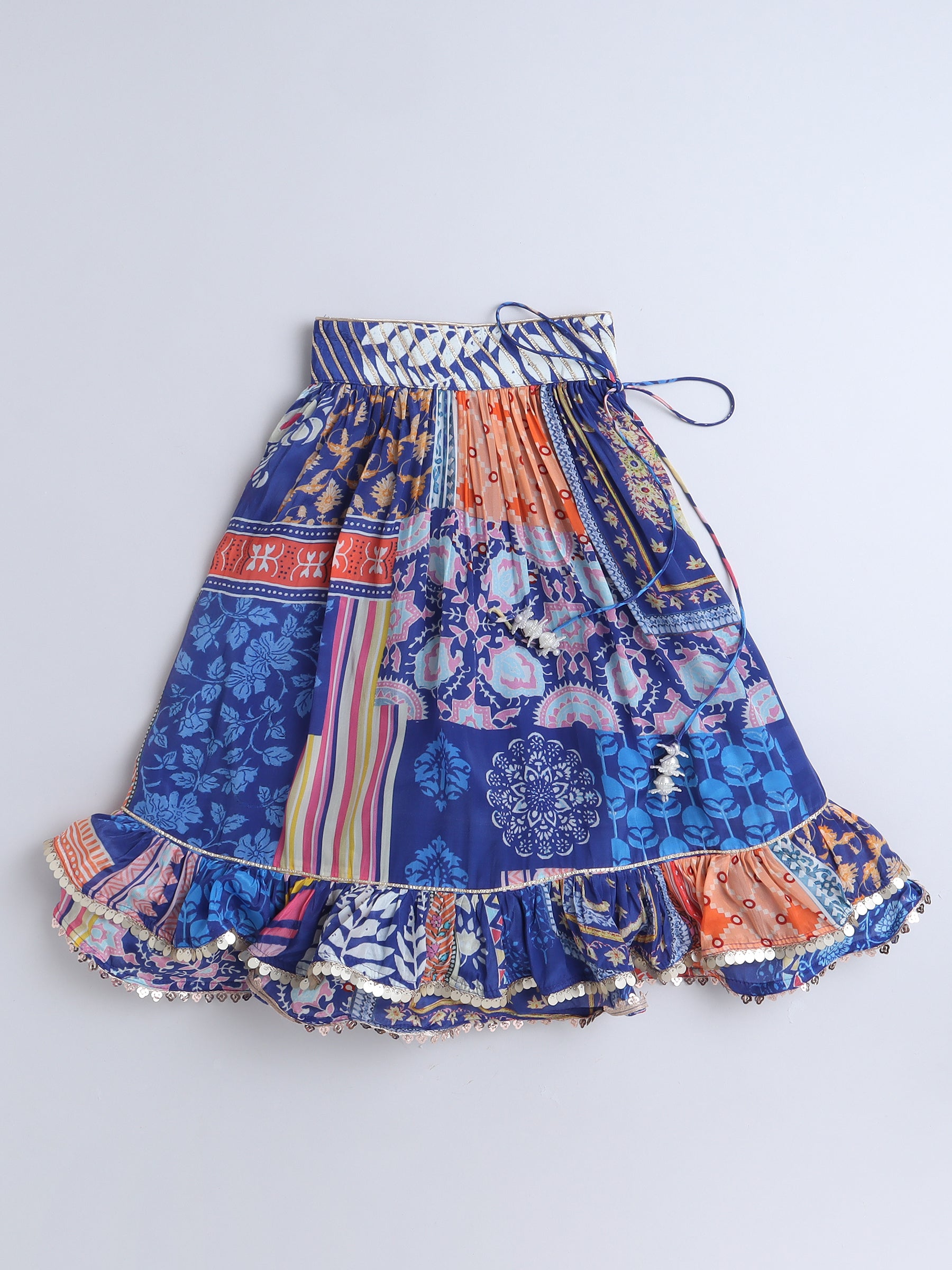Multicolored patterned skirt on a blue background
