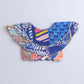 Colorful cowl blouse  with geometric patterns on a blue  background