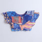 Colorful fabric blouse with patterns on a blue background