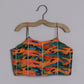 Girls Beautifully Crafted Orange Pleated Spaghetti Strap Top And Printed Layered Lehenga - funlittleones.com