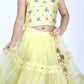 Close-up of sleeveless yellow choli with colorful 3D floral embroidery and V-neckline for girls
